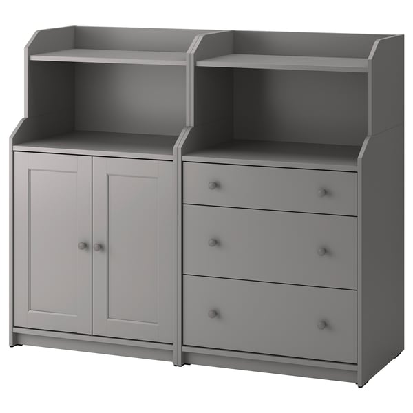 A gray HAUGA storage unit with shelves and drawers. It combines open and closed storage, designed for versatile use throughout the home.