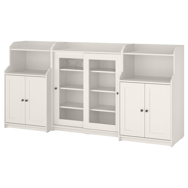 Three-piece white HAUGA storage set; mix of open and closed shelves, glass doors on central unit.