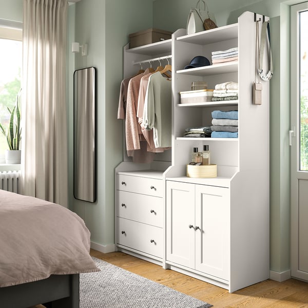 Bedroom with HAUGA storage: wardrobe & dresser. Wardrobe has shelves and hangers, cabinet. Dresser has three drawers. Light wood floor, gray rug.