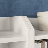 HAUGA white shelf with woven basket and books.