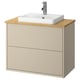 Beige bathroom cabinet with bamboo countertop, white basin & silver faucet.