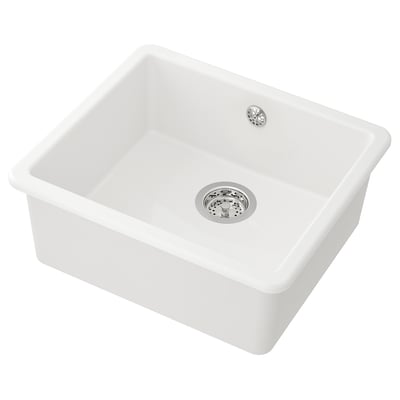 A white HAVSEN kitchen sink, square-shaped with rounded corners, made of ceramics. It a single bowl and a stainless steel drain.