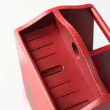 Red wooden knife block; sturdy, smooth finish; holds multiple knives; slanted design for easy access; two compartments for utensils or napkins.