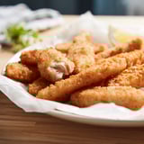 Golden-brown, crispy fish bites on a plate. Perfect for a quick, tasty meal.