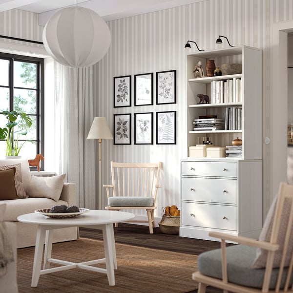 Living room with HAVSTA white chest, chair, bookshelf, and coffee table.
