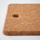 Square cork mat with smooth edges and small center hole, showcasing natural texture and color variations.