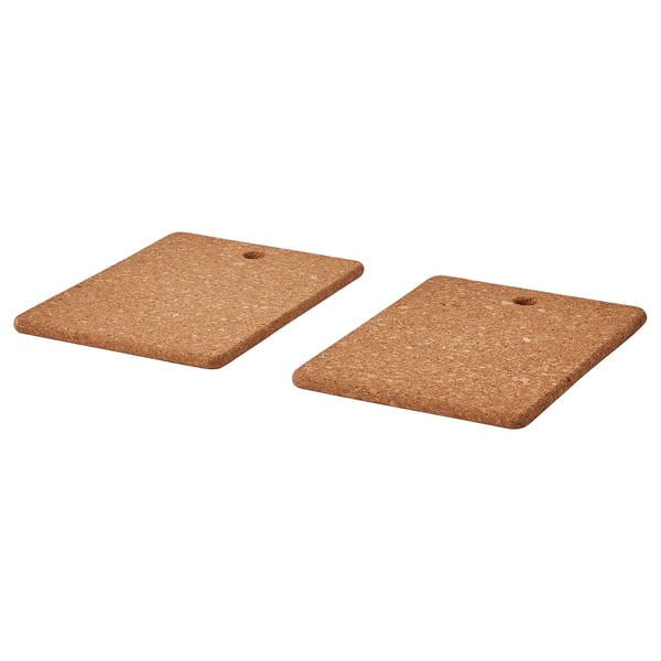 Two brown cork stands side by side.