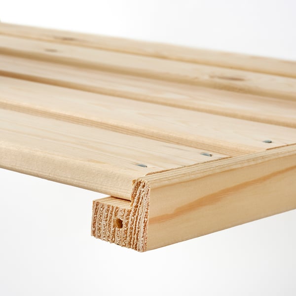 Close-up of HEJNE solid pine shelf, showcasing its smooth, sturdy, and neatly finished wood texture.