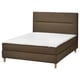 An olive green HEMFJÄLLET divan bed with a soft headboard and wooden legs. It includes a white mattress and is designed for comfort and modern style.
