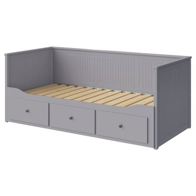 Gray HEMNES day-bed with drawers, wooden frame, upholstered base, rectangular shape, and vertical panel design.