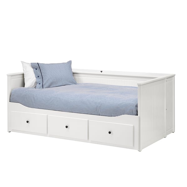 White day-bed with storage drawers and striped bedding.