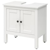 Ikea HEMNES white under sink cabinet, rectangular shape, two doors with black knobs.