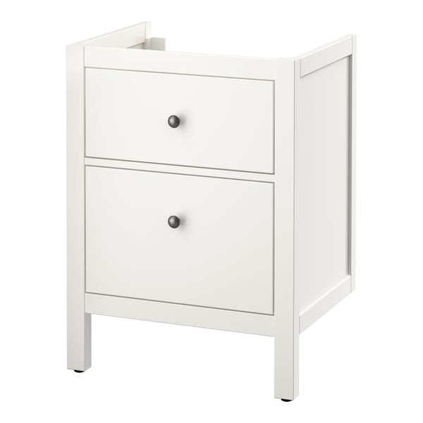 An ikea HEMNES white bathroom vanity cabinet with two drawers. It has a simple, classic design with black knobs.
