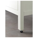 Close-up of HEMNES bathroom cabinets adjustable divider and smooth-closing drawer mechanism.