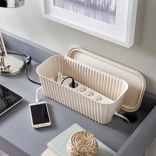 Desk cable box hides cords, keeping area tidy and clutter-free.