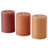 Three candles: red, orange, yellow, side by side, white wicks, gradient effect.
