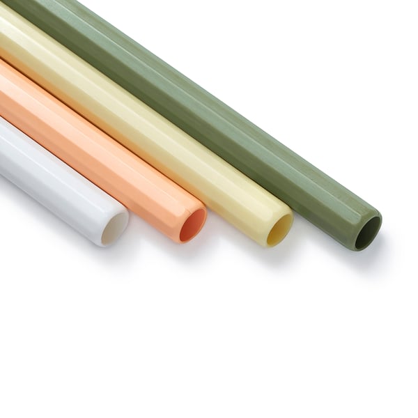 Four colourful straws in orange, white, green, and yellow, arranged against a white background.