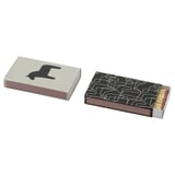 HYLTA matches: one box with black dala horse, other with black-white folk art.
