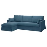 A blue l-shaped sofa with a slipcover, featuring a modern design with plush cushions.