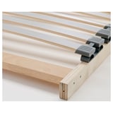 Close-up of sturdy, high-quality wooden bed frame with sleek slatted design and durable hardware.