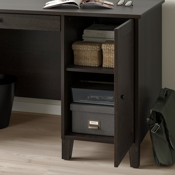 Desk with open door showing storage baskets and a labeled box for organizing papers. Soft-closing feature visible.