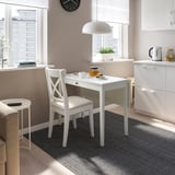 Small white IDANÄS desk, neat light beige chair, modern design for tight spaces.