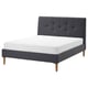 Modern grey upholstered bed with tufted headboard and wooden legs.