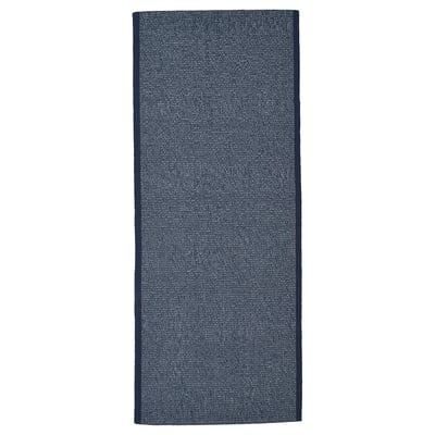 Dark blue rectangle cotton rug with white fibers; simple, flat surface.