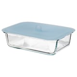 A clear glass food container with a blue lid by IKEA 365+, rectangular shape, oven-safe, with a vacuum-sealed lid for food storage.
