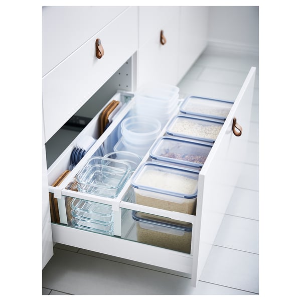 IKEA 365+ white food containers in drawer, clear plastic with blue lids, organized kitchen storage.