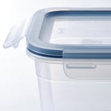 Clear plastic food container with secure-fitting lid, showing durable and transparent design.