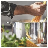 Cooking spaghetti with herbs.