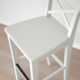 Modern white chair, sleek design. Solid wood, acrylic paint finish. Comfortable, sturdy seating.