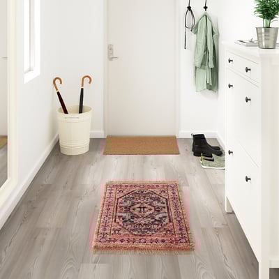 ISGRÄS red wool rug, rectangular, patterned, fits under white furniture, small in size.