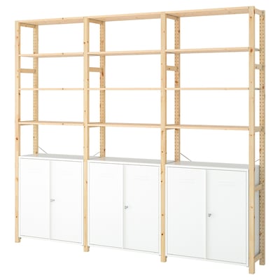 Light wood IVAR unit, white cabinets, upright shelves, natural wood grain.