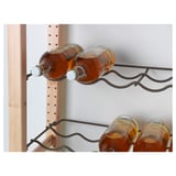 Image shows IVAR wine racks holding bottles securely with metal holders.