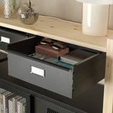Open IVAR storage drawer revealing items inside, demonstrating its organizational function.