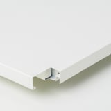 Close-up of durable, white IVAR shelf, showing sturdy, powder-coated steel construction.