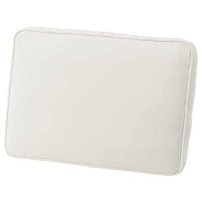 The JÄRPÖN cushion cover is cream-colored, rectangular with rounded edges, and a simple, elegant design.