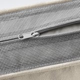 Close-up of zippered mesh pouch, demonstrating quality fabric and durable zipper.