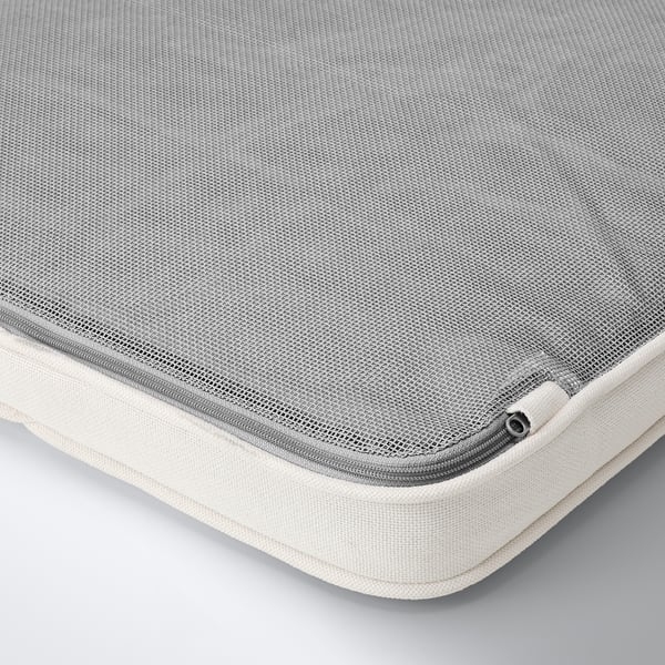 Close-up of a well-crafted, textured cushion. Mesh and padded fabric, showcasing high-quality materials. Anti-slip dots visible on one edge.