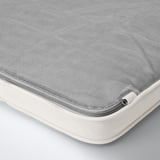 Close-up of a well-crafted, textured cushion. Mesh and padded fabric, showcasing high-quality materials. Anti-slip dots visible on one edge.