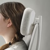 Image shows a person using an office chair with adjustable backrest and armrests. The ergonomic design supports posture and comfort.