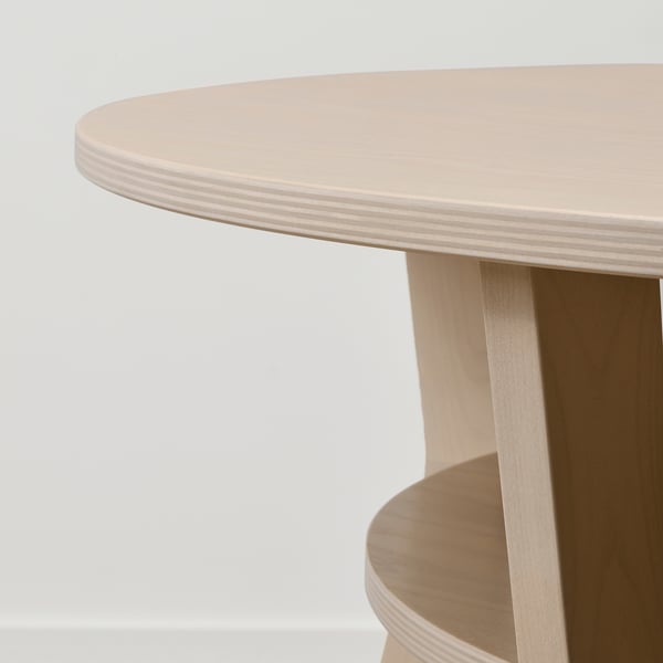 Sleek, round coffee table with minimalist design. Crafted from birch plywood and oak veneer, showcasing natural wood grain and smooth finish.