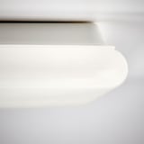 Modern white light panel, sleek design, smooth curves, flat surface.