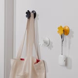 Hooks: simple, colorful snowflake design. Sturdy, hold up to 2 kg. Hangs bags, accessories. Easy to attach, decorative storage.
