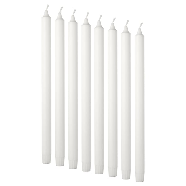 Eight white candles. Simple, cylindrical shape with cotton wicks. Arranged in pairs, standing upright.