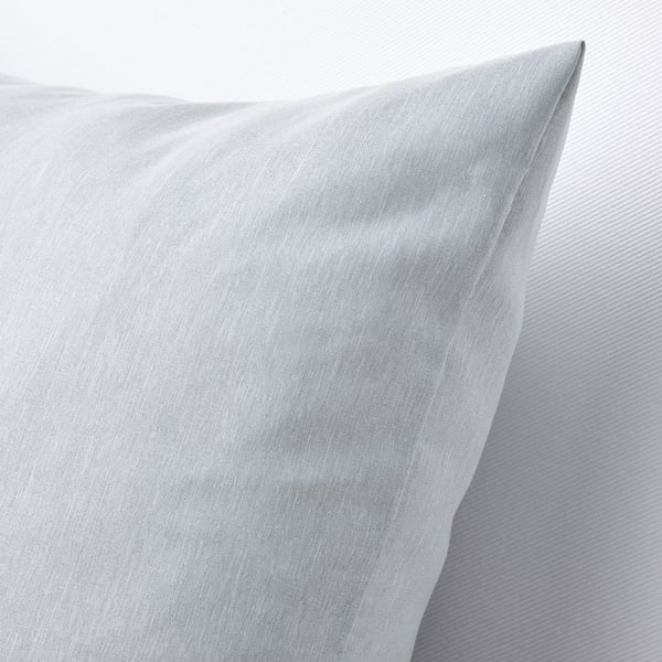 Light blue textured cushion, soft and supportive, displayed on a neutral background.