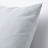 Light blue textured cushion, soft and supportive, displayed on a neutral background.