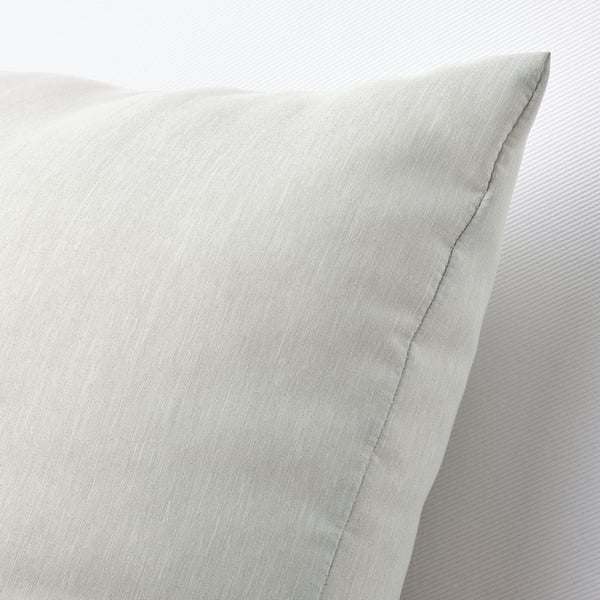 Close-up of a plush, eco-friendly cushion made from recycled materials, showcasing its soft texture and delicate sheen.